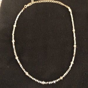 Grey onyx/gold fashion necklace.